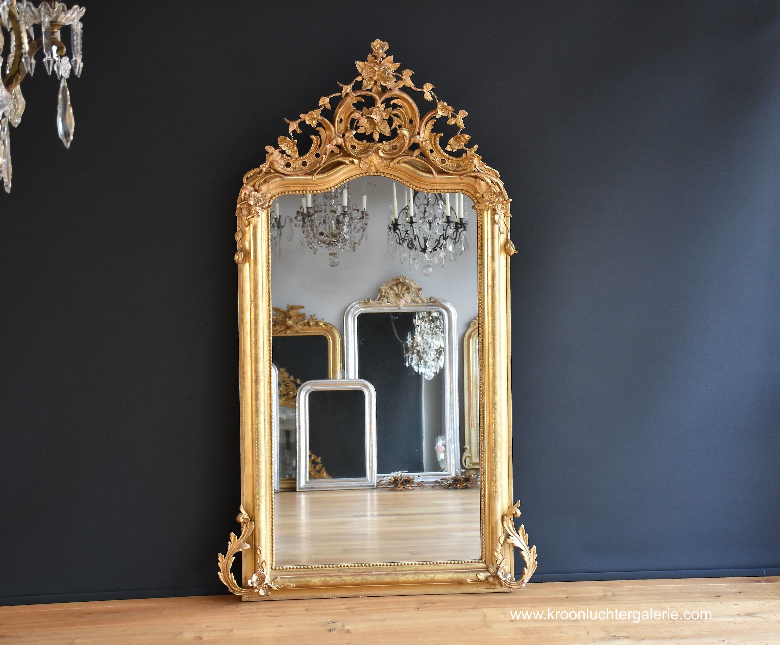 Large antique French mirror with a gorgeous crown