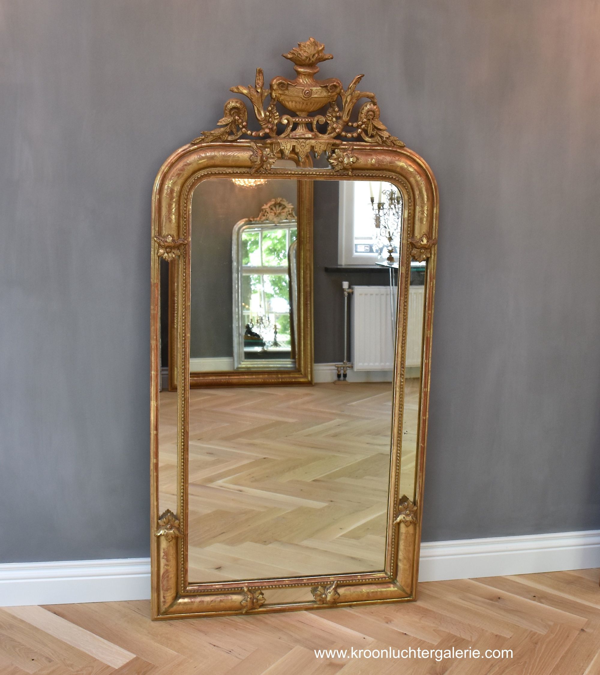 19th c.French gold-leaf mirror with a crown
