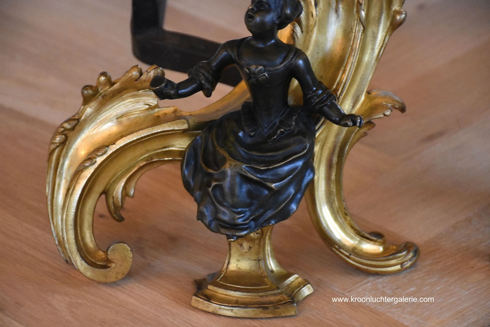 A pair of 19th c. gilt bronze chenets in the style of Louis XV
