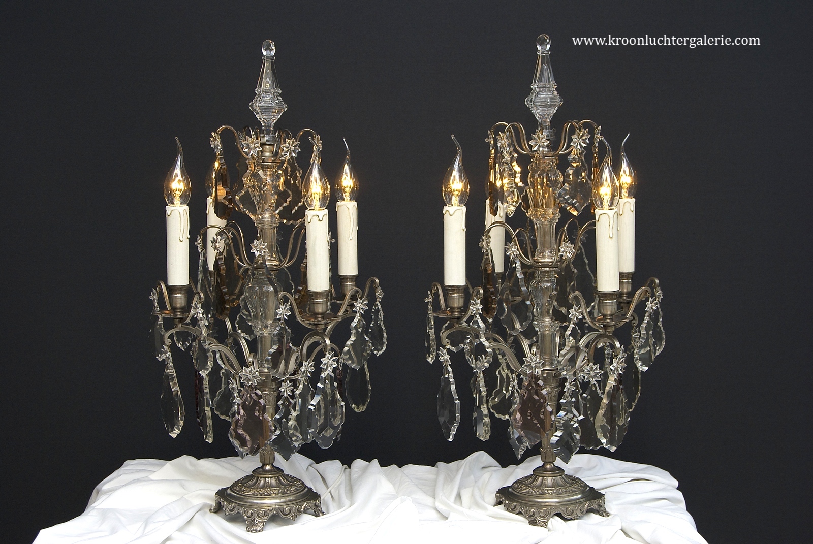 A pair of French silver-coloured table lamps/ girandoles