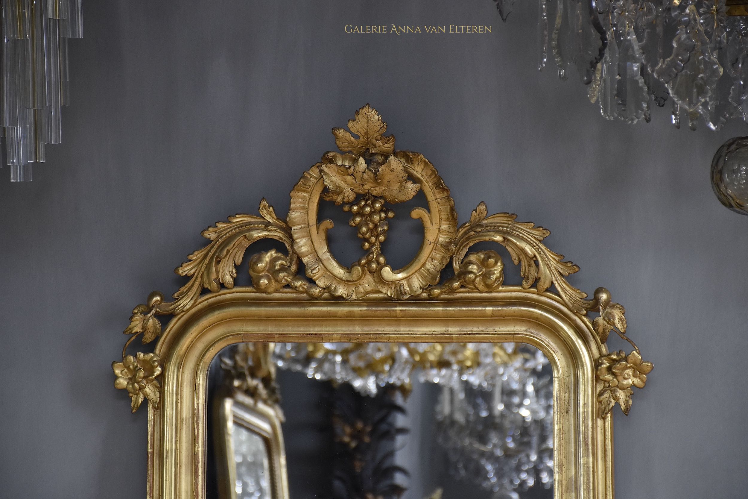 19th c. gilded and carved French mirror with a crown