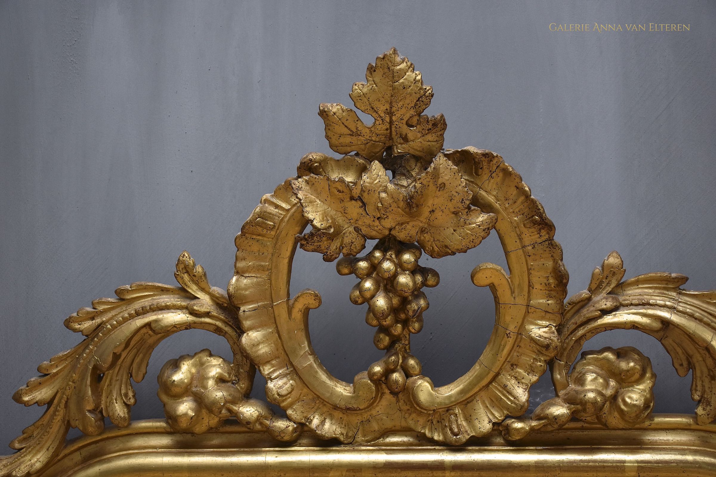 19th c. gilded and carved French mirror with a crown