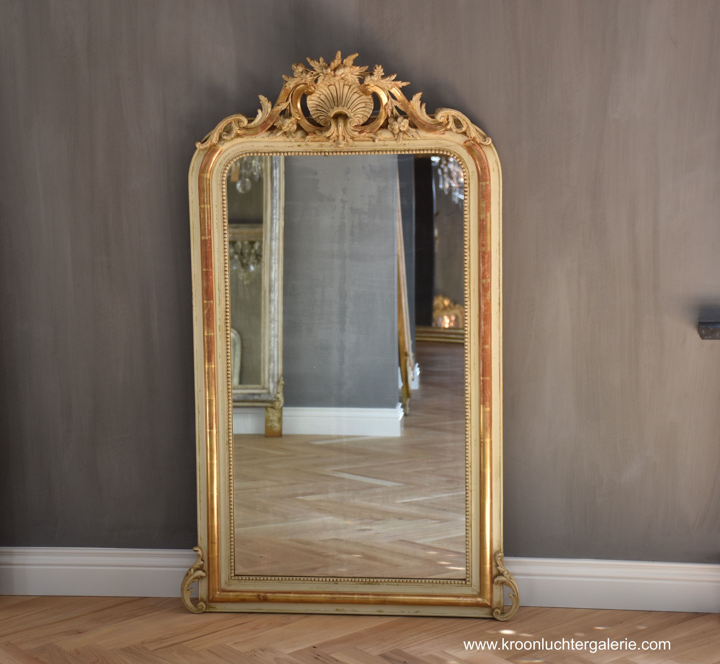 Antique French mirror with a crest