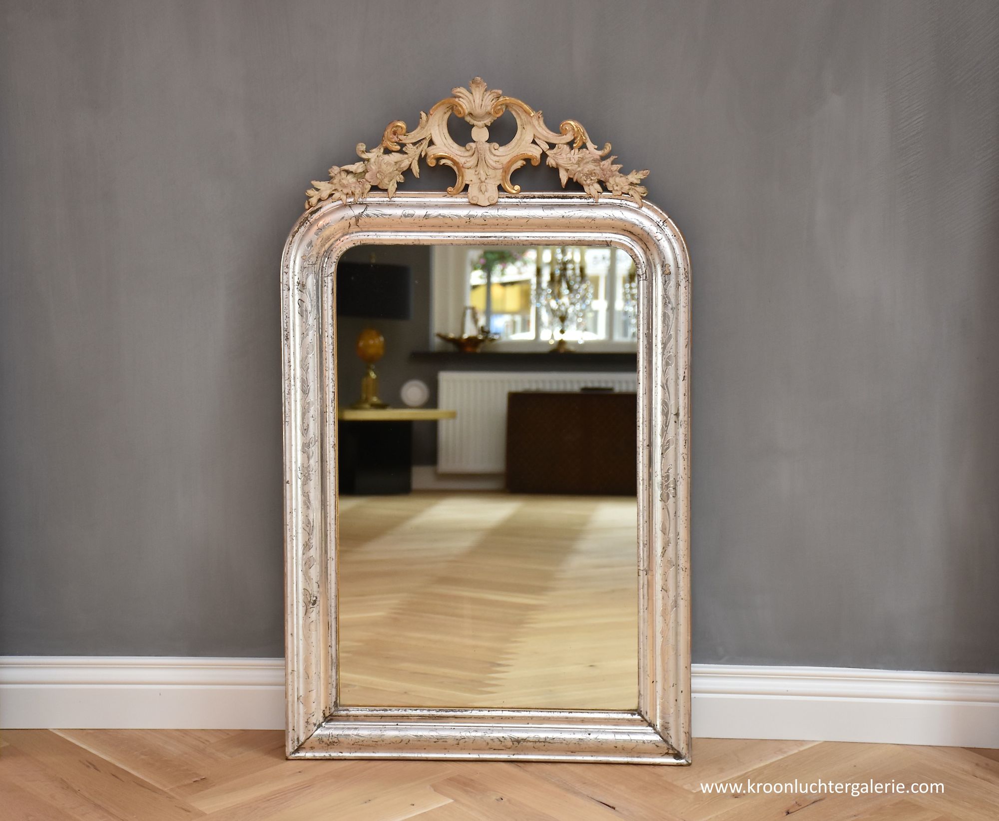 19th c. silver leaf French mirror with crest