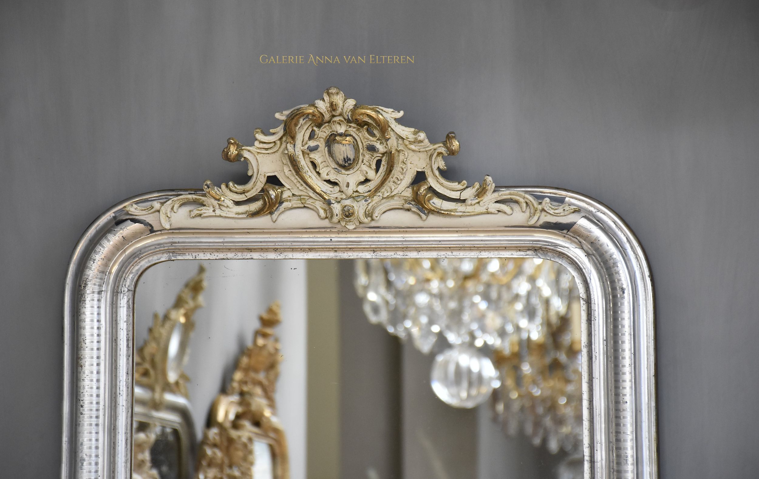 Large antique French mirror Louis-Philippe with a crest