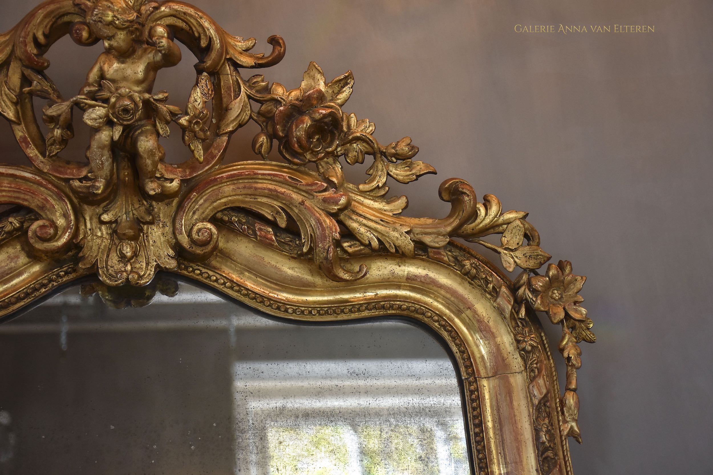 19th c. large impressive French mirror with a fabulous crown and putti