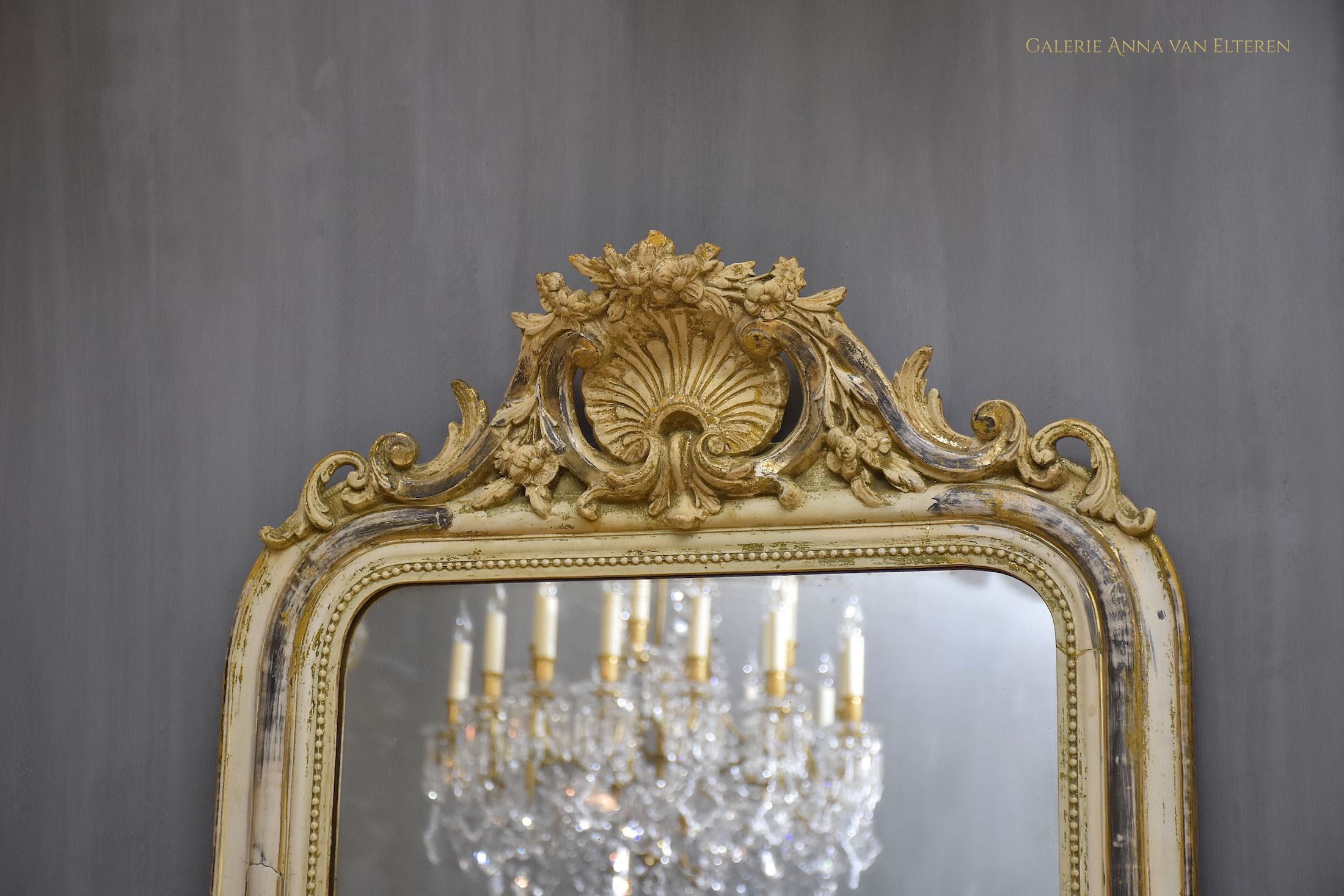 19th c. antique French mirror with a crest