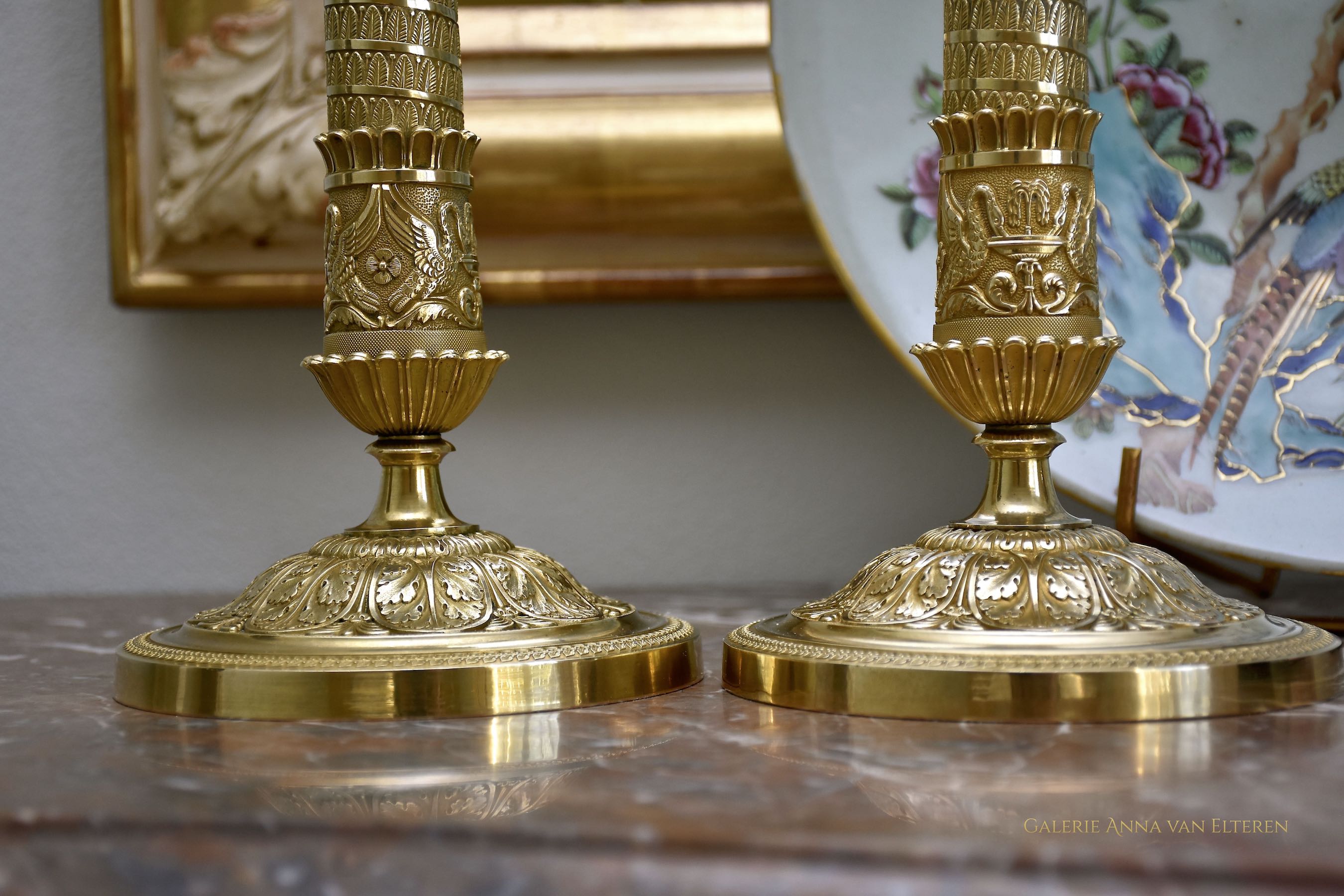 A fine pair of 19th c. gilt and chased bronze candlesticks