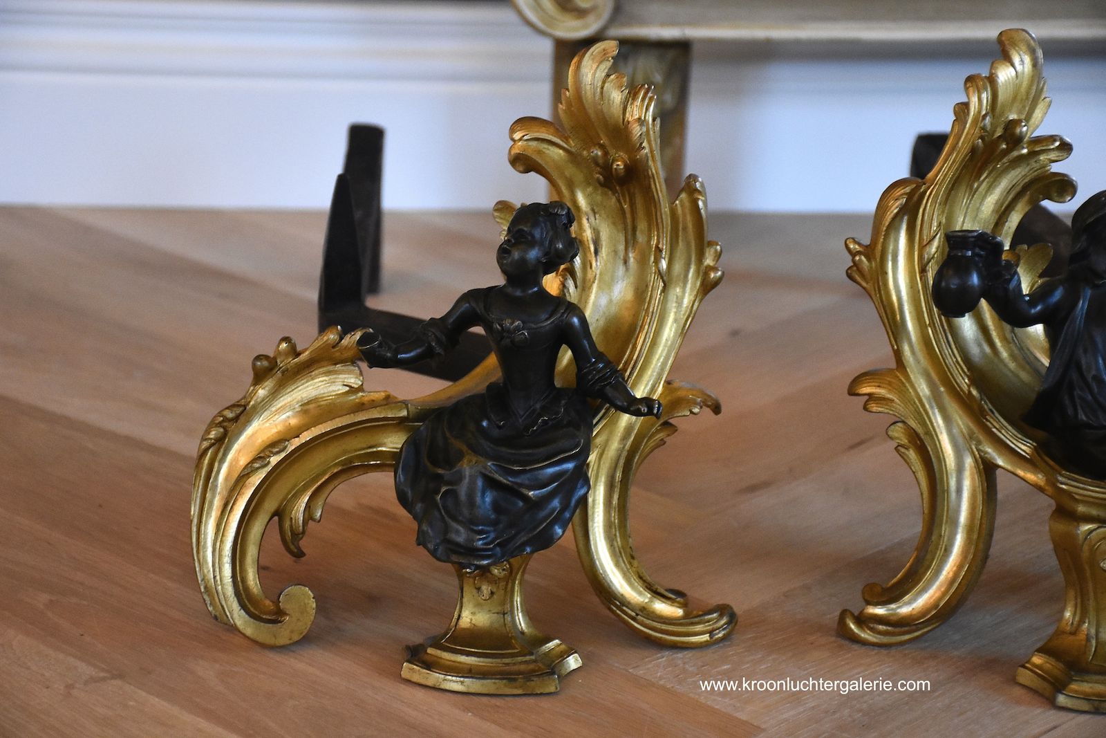 A pair of 19th c. gilt bronze chenets in the style of Louis XV