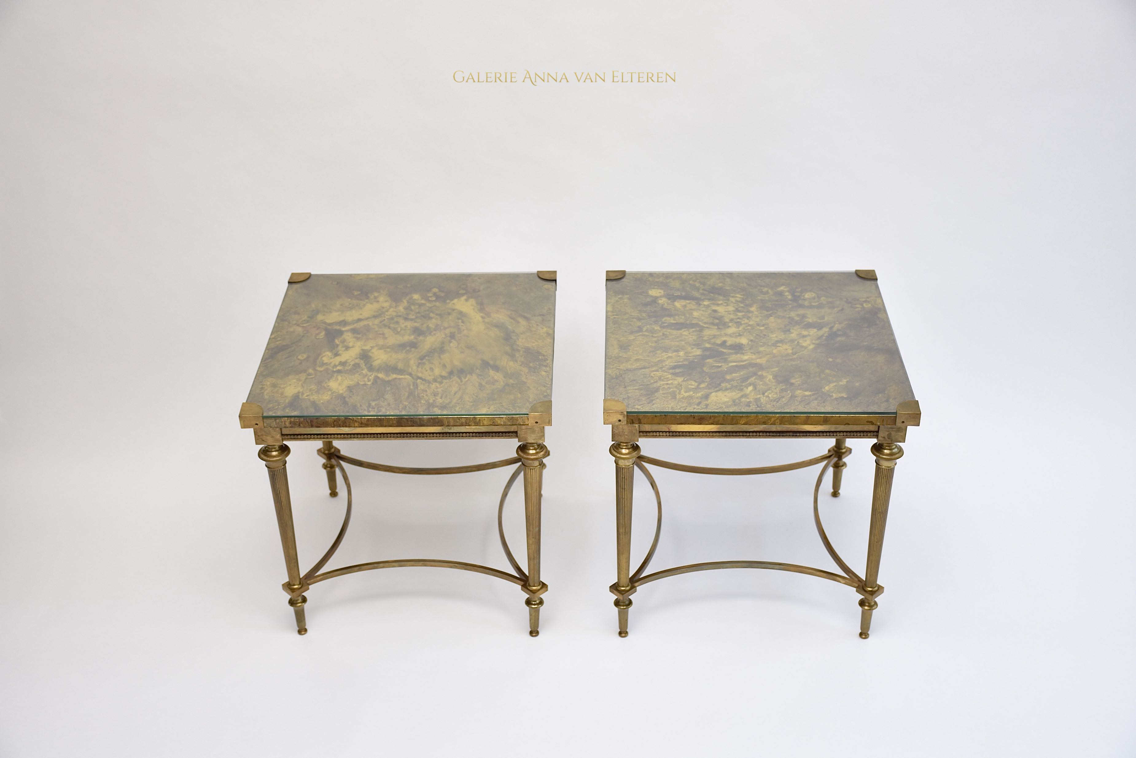 A pair of neoclassical brass side tables
