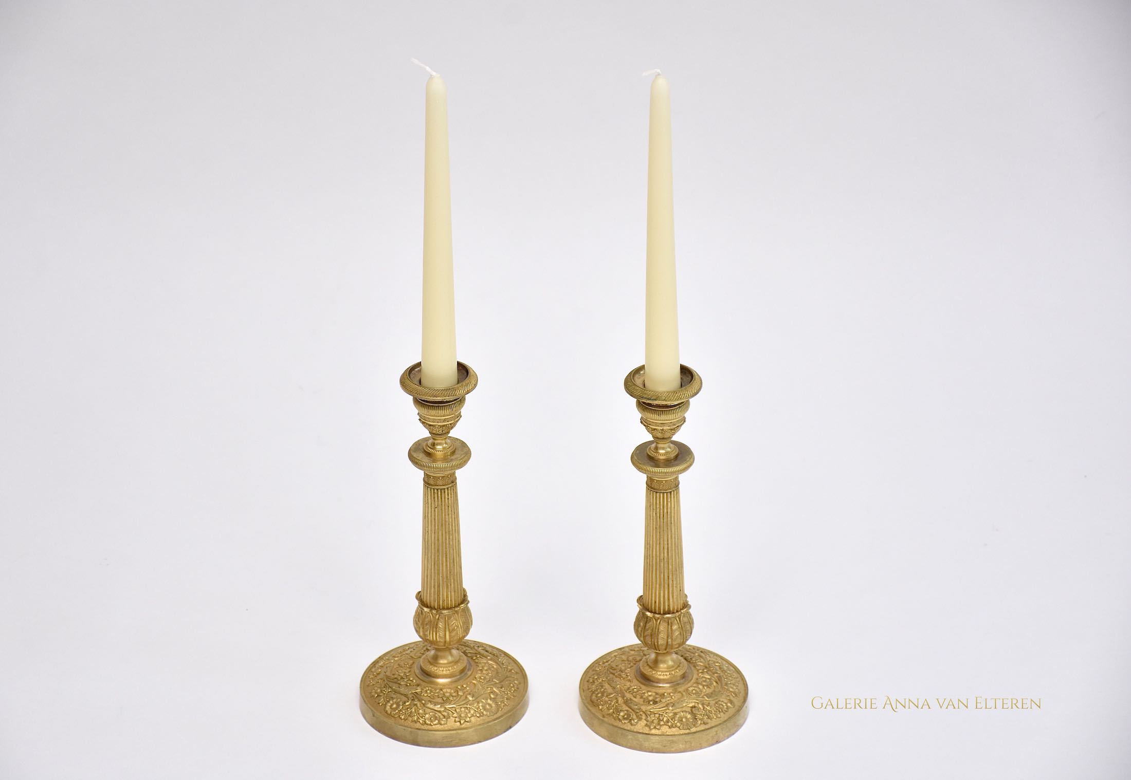 A pair of 19th c. gilt bronze Empire candlesticks