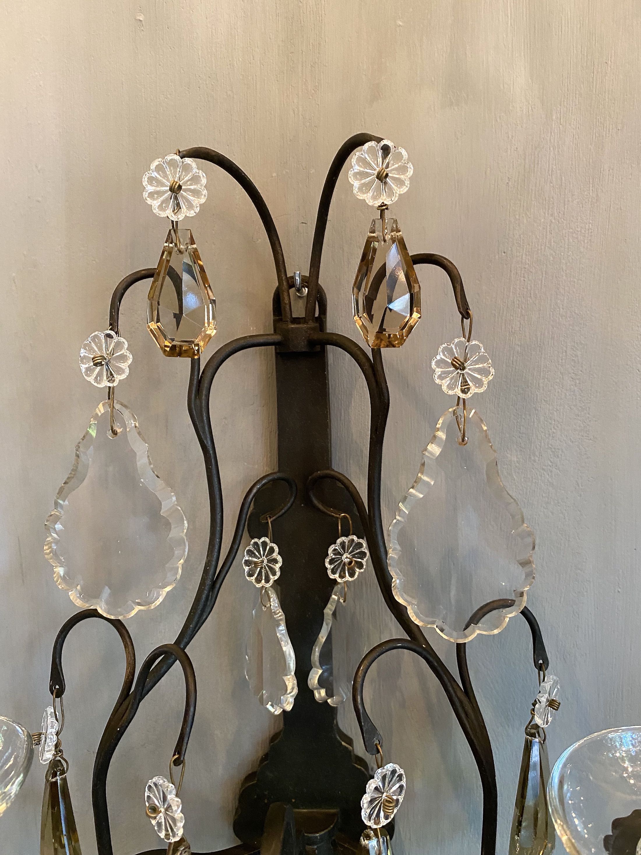A pair of antique French wall lights