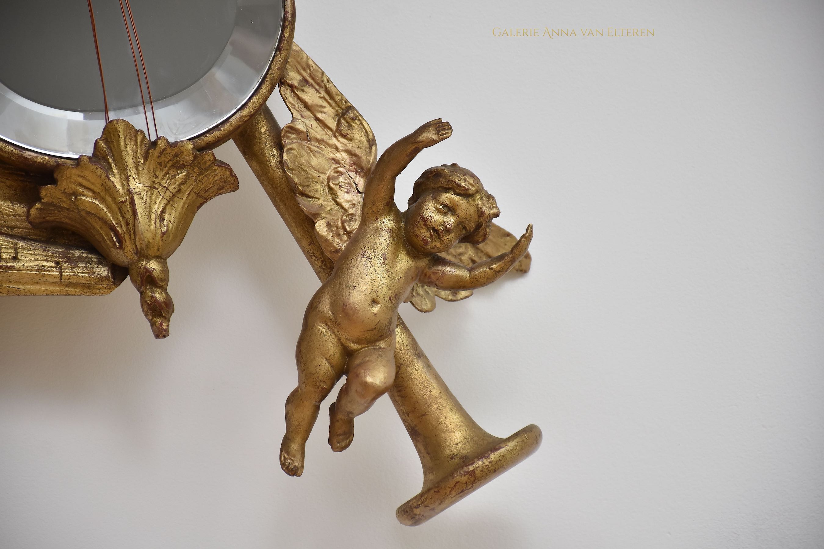 19th c. carved & gilded mirror with putti