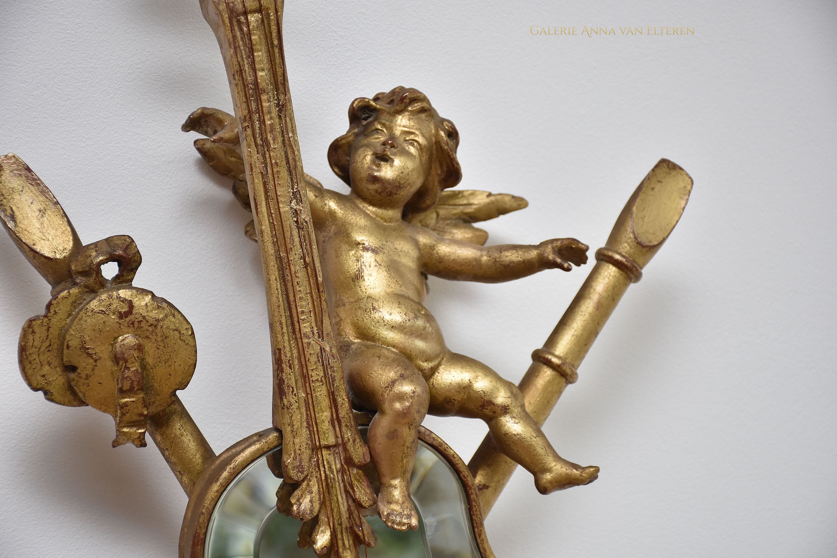 19th c. carved & gilded mirror with putti