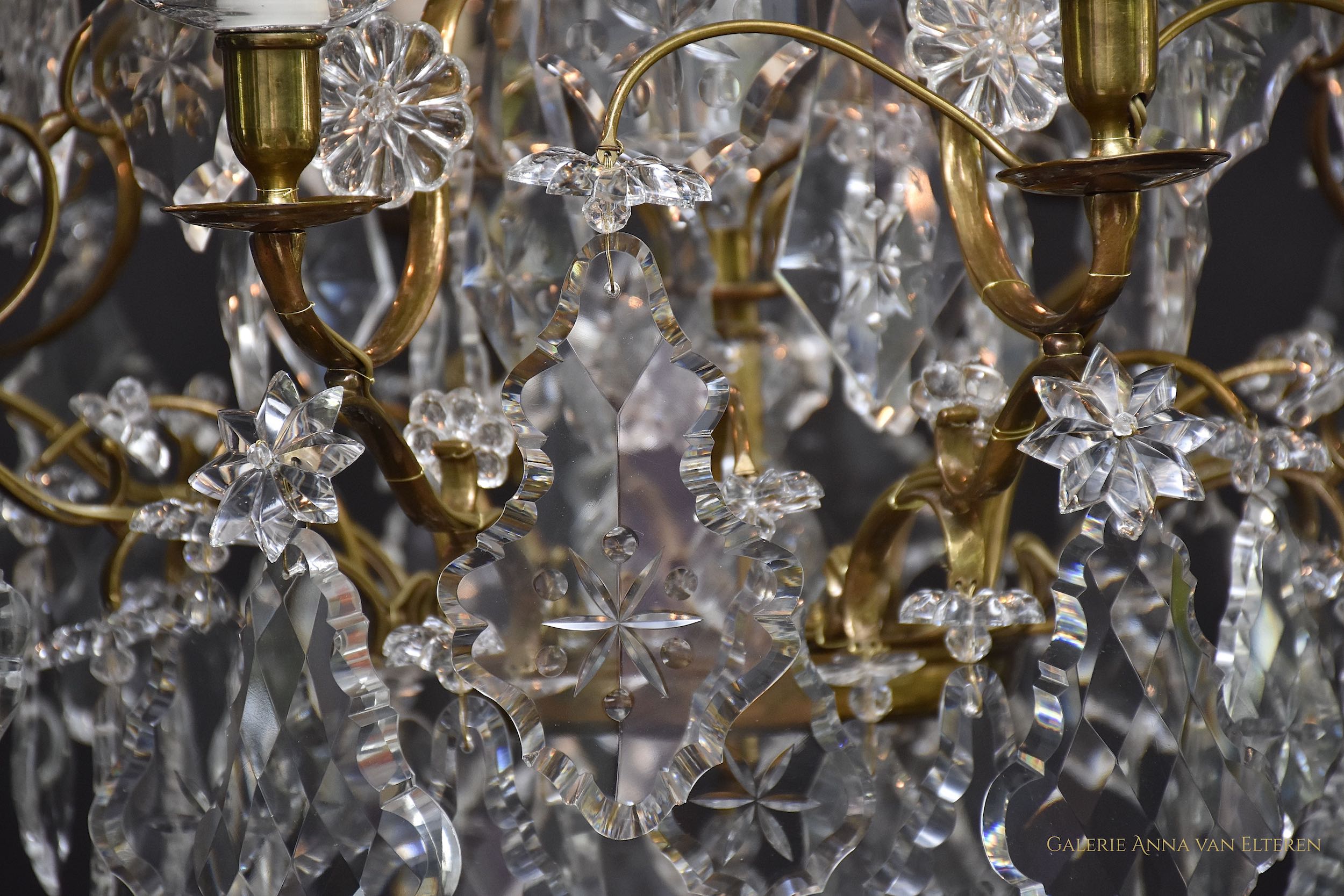 A pair of Rococo style crystal chandeliers