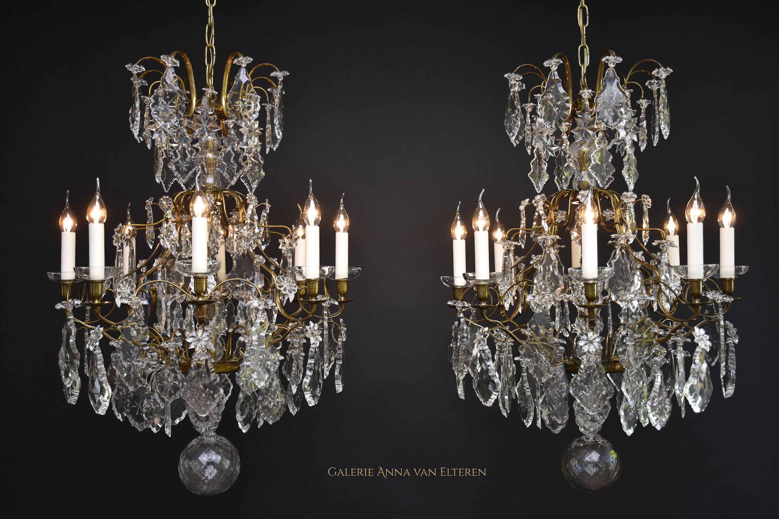 A pair of Rococo style crystal chandeliers