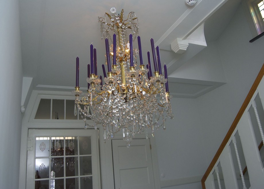 French candle chandeliers in the living room & in the entrance